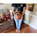 This shows me standing and holding Thisbe the pumpkin gourd. His pumpkin friends are sitting in the background waiting for their turn.